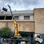 Evap condensers being removed off roof
