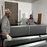 Team discussing Evaporator coils installation